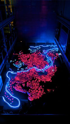 display the urban evolution of a city with light