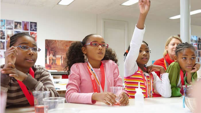 Students and the classroom illuminated by Philips Lighting