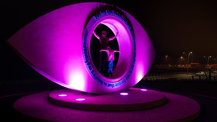 The dynamic color lighting effects are provided by ColorBlast fixtures attached to the curved poles of MileWide LED.