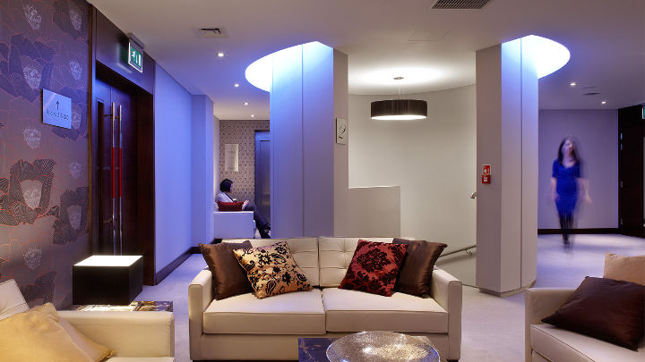 The lights in this Rafayel Hotel lounge helps provide a unique and memorable guest experience through light