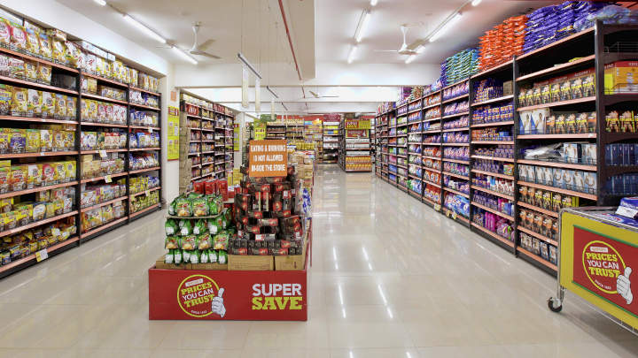 LED battens providing uniform lighting at isles within the supermarket