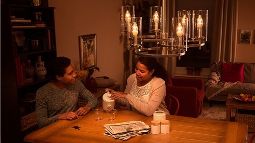 Two people sitting on the couch at home enjoying high quality LED light